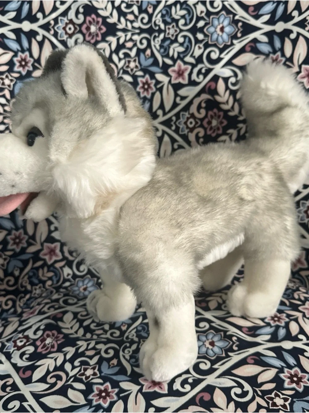 Siberian Husky dog toy with blue eyes and a happy open mouth showing its tongue